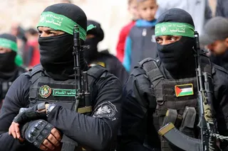 Fighters of the Ezzedine al-Qassam Brigades, Hamas's armed wing, attend the funeral of two fighters in Gaza City on January 24, 2025, after a ceasefire deal in the war between Israel and Hamas in the coastal Palestinian territory. A senior Hamas official told AFP that his group will provide on January 24, the names of four Israeli women hostages to be freed the following day as part of a second release under the ceasefire with Israel. The truce, the second in the more than 15 months of war, bega