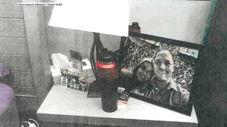Framed photo of Brendan Banfield and Juliana Peres Magalhães on a bedside table