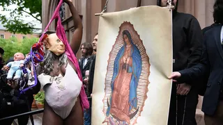 A pro-choice activist confronts anti-abortion activists outside a Catholic church in New York City