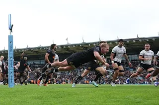 Max Norey dives over to score Exeter’s first try against Saracens.