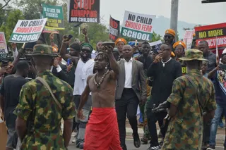 People protest demanding government to rescue the school children that were recently kidnapped in various part of the country, on the street of Abuja, Nigeria. Thursday, June 4, 2026. (AP Photo/Olamikan Gbemiga)