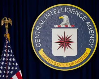 seal for CIA next to american flag