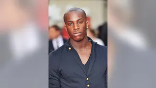 Talay Riley standing outside Odeon Leicester Square in London attending a film premiere.