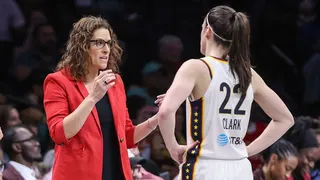 Indiana Fever head coach Stephanie White talking with guard Caitlin Clark during a basketball game at Barclays Center
