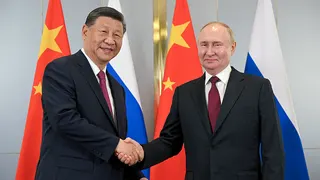 Xi Jinping and Vladimir Putin standing side by side