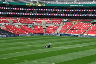 Ground staff prepare the Azteca Stadium pitch for the opening match