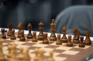 Chess pieces are set up