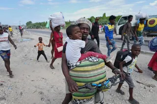 Residents flee their homes to escape clashes between armed gangs in Port-au-Prince, Haiti last month. Photo: AP