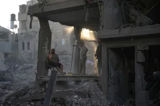 Palestinians clear the rubble of a building that was destroyed in an Israeli airstrike, at al-Maghazi refugee camp, central Gaza Strip, Friday, June 12, 2026. (AP Photo/Abdel Kareem Hana)