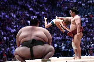 Children get hands-on sumo demonstrations from a sekitori