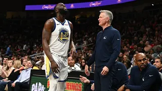 Draymond Green and head coach Steve Kerr reacting during a basketball game at State Farm Arena