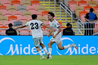Soccer Football - FIFA World Cup - AFC Qualifiers - Group B - Iraq v Indonesia - King Abdullah Sport City, Jeddah, Saudi Arabia - October 11, 2025 Iraq's Zidane Iqbal celebrates scoring their first goal with Merchas Doski REUTERS/Stringer