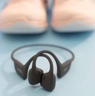 Picture of Shokz OpenRun Pro 2 in front of sneakers