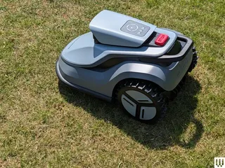 Image may contain: Grass, Lawn, Plant, Device, Lawn Mower, Tool, Machine, and Wheel