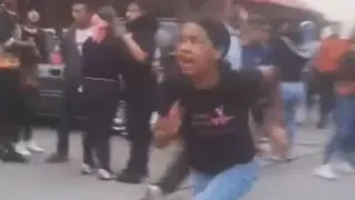 A girl runs from building damagd by earthquake in  El Junquito near Caracas
