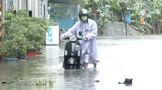 Floodwater during heavy rain in Kaohsiung, Taiwan, caused by the nearby passing of Typhoon Mekkhala as it headed towards Japan, on June 25.
