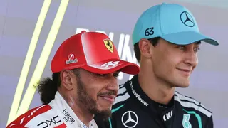 Lewis Hamilton and George Russell pose for photographs after the Barcelona-Catalunya Grand Prix