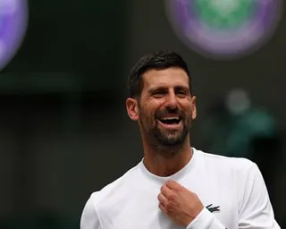 Novak Djokovic reacts as he practises on No 1 Court at Wimbledon