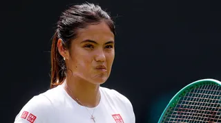 Emma Raducanu chews her lip during practice at Wimbledon