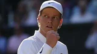 Jannik Sinner celebrates winning a point at Wimbledon in 2025