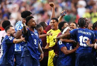 The celebrations begin as news of Uruguay’s result against Spain filters through to the players