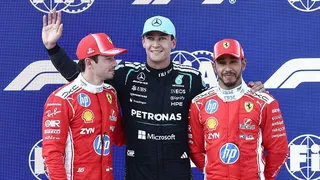 Charles Leclerc, George Russell and Lewis Hamilton pose for photos after qualifying