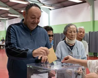 People queue to vote in provincial elections at a polling station in Noumea, New Caledonia