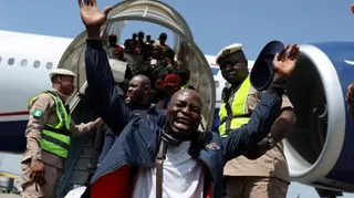 A man reacts after disembarking from an aircraft, as authorities repatriate citizens fleeing xenophobic attacks in South Africa, at Murtala Muhammed International Airport in Lagos, Nigeria, June 11, 2026.