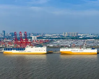 Transport ships loaded with cars at a dock
