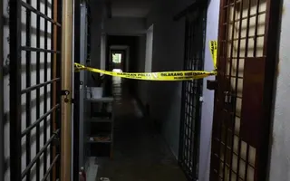 Police have cordoned off the unit on the third floor where a body was found in a suitcase.-Courtesy pic