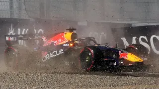 Red Bull's Max Verstappen throws up gravel as it crashes into the barrier during qualifying for the Austrian Grand Prix