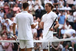 Germany's Alexander Zverev (R) shakes hands with Belgium's Alexander Blockx after winning him in their men's singles first round tennis match on the second day of the 2026 Wimbledon Championships at The All England Lawn Tennis and Croquet Club in Wimbledon, southwest London, on June 30, 2026. (Photo by HENRY NICHOLLS / AFP) / RESTRICTED TO EDITORIAL USE