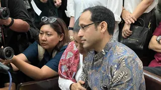 Nadiem's wife clutched his arm as they entered the courtroom on Tuesday morning