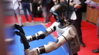 Humanoid robots strut their stuff as trade show comes to Japan
