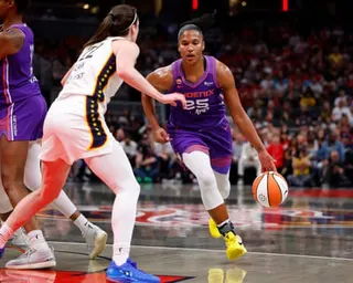 Alyssa Thomas of the Phoenix Mercury makes a drive against Caitlin Clark of the Indiana Fever in their game last Wednesday.