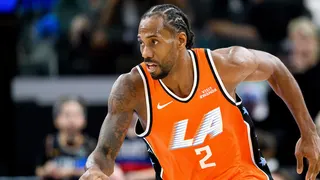 Los Angeles Clippers forward Kawhi Leonard dribbling basketball during game.