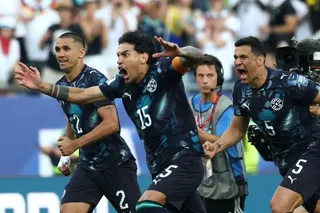 Paraguay's players celebrate after winning the penalty shootout during the 2026 World Cup round of 32 football match between Germany and Paraguay