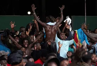 DRC fans react as they watch the match in Kinshasa.