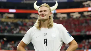 Erling Haaland wearing a plastic viking helmet after Norway beat Ivory Coast