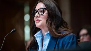 Lori Chavez-DeRemer wearing black glasses.
