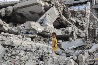 A Palestinian child stands on the rubble of a destroyed building near the al-Shati refugee camp, west of Gaza City, on July 1, 2026.
