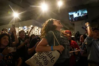 Celebrations after the first report of election results show Democratic congressional candidate Melat Kiros in the lead.