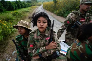 This photo taken on December 10, 2023 shows female members of the Mandalay People Defense Forces (MDY-PDF) heading to the frontline amid clashes with the Myanmar military in northern Shan State. More than 100,000 people have been killed across all sides in Myanmar since a military coup five years ago triggered civil war, a conflict monitor said today. — AFP pic