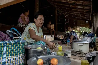 People displaced by the fighting preparing food at a shelter on the grounds of a monastery near Pakokku in Myanmar’s Magway region.