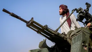 A Taliban soldier stands next to an anti-aircraft gun while on lookout for Pakistani fighter jets, in Khost province, Afghanistan, February 27, 2026.