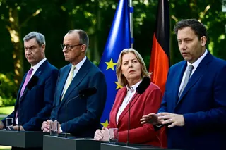 (L-R) Bavaria's State Premier and leader of the conservative Christian Social Union (CSU) Markus Soeder, German Chancellor Friedrich Merz (CDU), German Minister for Labour and Social Affairs Baerbel Bas (SPD) and German Finance Minister and Vice Chancellor Lars Klingbeil (SPD) address a press conference, on July 2, 2026 in the garden of the Chancellery in Berlin, one day after their coalition committee consultations on a major package of reforms.