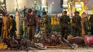 Experts investigate at the site of a blast in central Bangkok
