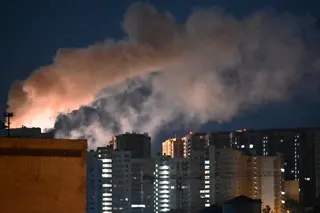 Smoke rises during a Russian missile strike on the Ukrainian capital Kyiv on July 2, 2026, amid the Russian invasion in Ukraine. Russian missile and drone strikes rocked Kyiv early on July 2, setting off fires and wounding at least five people, after President Volodymyr Zelensky warned that Moscow was preparing a "massive attack". (Photo by Sergei SUPINSKY / AFP)