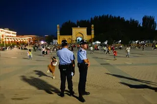 Police stand guard at the main square in Kashgar in China's Xinjiang region in this file image from 2023