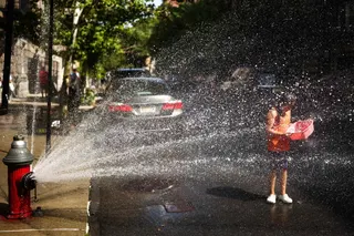 New Yorkers are opening fire hydrants to cool off as they try to escape the extreme heat. — AFP pic